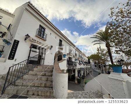 Streets of the white village of Mijas in Spain 125533623