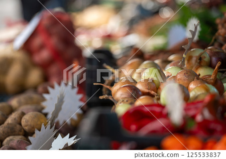 Fresh produce display at a vibrant farmers market showcasing colorful vegetables 125533837