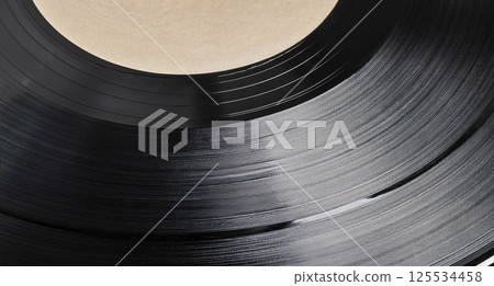 Track vinyl disc texture background. Classic vinyl record realistic black backdrop. Dark. Track vinyl disc texture background. Classic vinyl record realistic black backdrop. Dark. 125534458