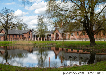 Zagare manor stables on a sunny spring day, Lithuania Zagare manor stables on a sunny spring day, Lithuania 125534848