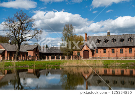 Zagare manor stables on a sunny spring day, Lithuania Zagare manor stables on a sunny spring day, Lithuania 125534850