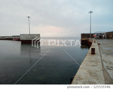 Concrete pier at sea. 125535546
