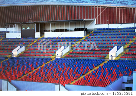 Empty sports stadium seats. An empty stadium Empty sports stadium seats. An empty stadium 125535591