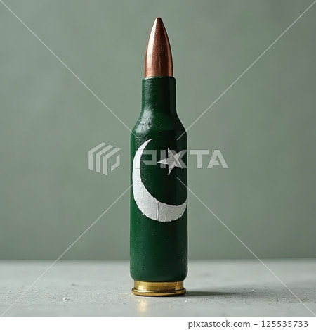 Bullet in Pakistan green and white with crescent and star, symbolizing national identity and military concept. 125535733