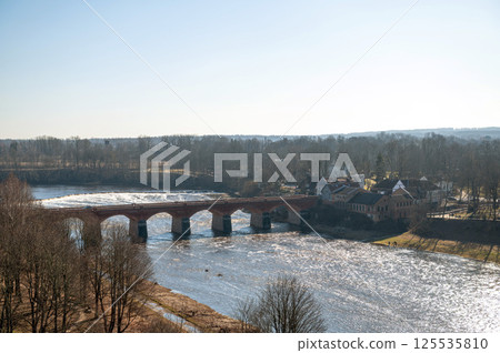 Old red brick bridge over Venta river in Kuldiga - UNESCO World Heritage site, Latvia 125535810