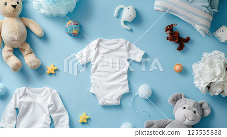 Baby white body suit on blue background with toys around. Cozy mockup, flatlay, top view Baby white body suit on blue background with toys around. Cozy mockup, flatlay, top view 125535888