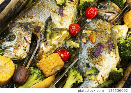Delicious roasted fish sea bream, BBQ. Delicious roasted fish sea bream, BBQ. 125536092
