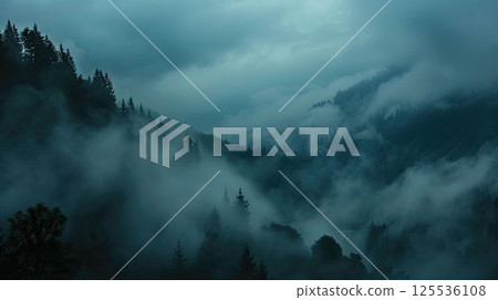 Thick morning fog rolling over a mountain valley, mystical and moody atmosphere Thick morning fog rolling over a mountain valley, mystical and moody atmosphere 125536108