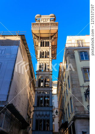 Santa Justa lift in Lisbon, Portugal. Famous landmark and entertaining tourist attraction with viewing platform upstairs Santa Justa lift in Lisbon, Portugal. Famous landmark and entertaining tourist attraction with viewing platform upstairs 125537197