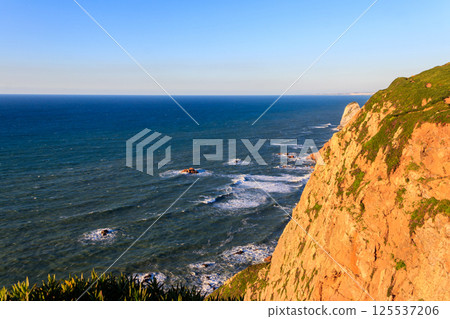 View of the Atlantic Ocean from Cabo da Roca. Cabo da Roca or Cape Roca is westernmost cape of mainland Portugal, continental Europe and the Eurasian land mass View of the Atlantic Ocean from Cabo da Roca. Cabo da Roca or Cape Roca is westernmost cape of mainland Portugal, continental Europe and the Eurasian land mass 125537206