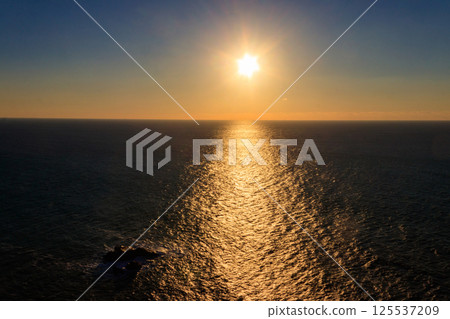 View of the Atlantic Ocean from Cabo da Roca at sunset. Cabo da Roca or Cape Roca is westernmost cape of mainland Portugal, continental Europe and the Eurasian land mass View of the Atlantic Ocean from Cabo da Roca at sunset. Cabo da Roca or Cape Roca is westernmost cape of mainland Portugal, continental Europe and the Eurasian land mass 125537209