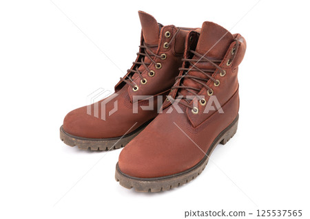 Pair of brown working boots isolated on white background. 125537565