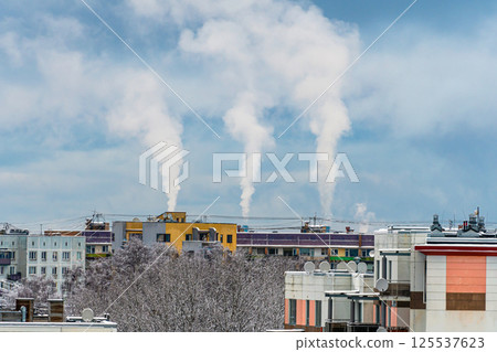 Smoke from the chimneys of the factory on the background of the city 125537623