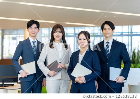 Businessmen working in an office. Photo courtesy of Denpa Gakuen, Tokyo Electronics College. 125538138