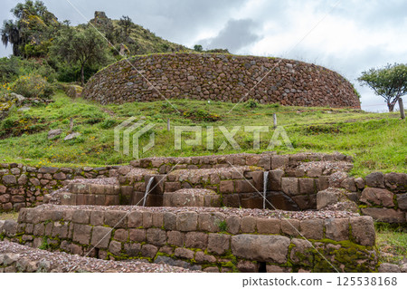 Ancient Inca fountain and stone structures at Pisac, Sacred Valley, Peru 125538168