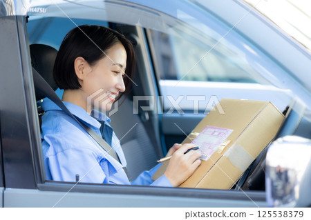 Woman, work clothes, delivery Woman, work clothes, delivery 125538379