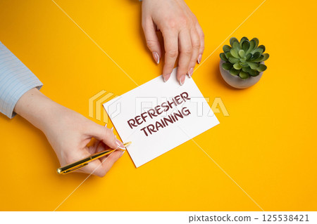 Refresher training concept. Type of training designed to revisit and reinforce knowledge, skills, or procedures that were learned in the past. The woman points to the notes with the inscription 125538421