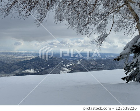 The surrounding mountains in winter 125539220