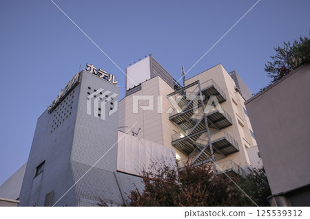 Architecture of an Urban Hotel Building at Dusk with Clear Sky Dec 8 2024 Architecture of an Urban Hotel Building at Dusk with Clear Sky Dec 8 2024 125539312