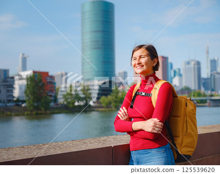 Tourist woman explores modern Frankfurt, 125539620