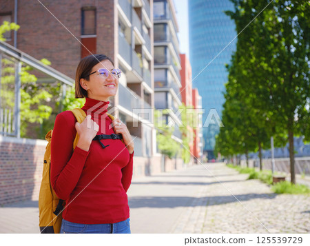 Tourist woman explores modern Frankfurt, Tourist woman explores modern Frankfurt, 125539729