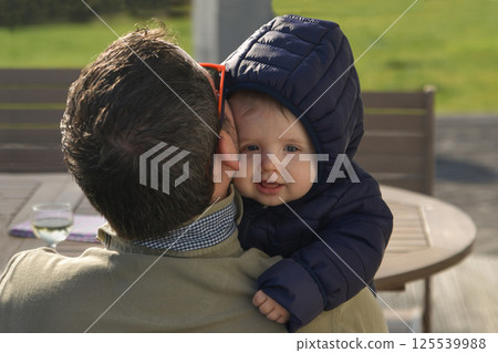 Father and his nine month old baby 125539988