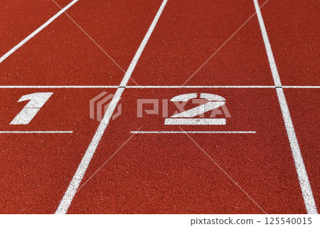 The red runway is numbered at a stadium 125540015