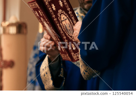 Armenian priest with a bible. The Apostolic Church. 125540054