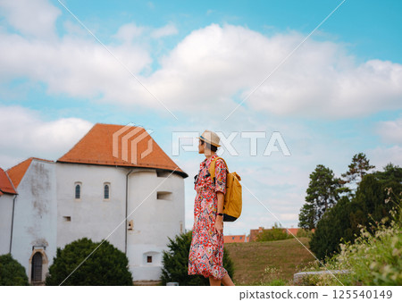 Woman Walking Through the Historic Center of Varazdin 125540149