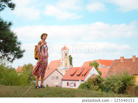 Woman Walking Through the Historic Center of Varazdin 125540151