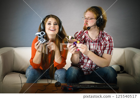 Gaming couple playing games 125540517