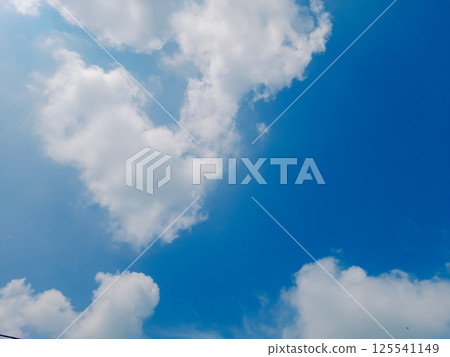 Bright clouds in the sky with a blurred background 125541149