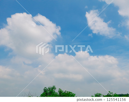 Bright clouds in the sky with a blurred background 125541156