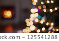 Abstract christmas tree lights bokeh effect colorful glowing circles blurred background fireplace warmth festive holiday mood celebration energy blur 125541288
