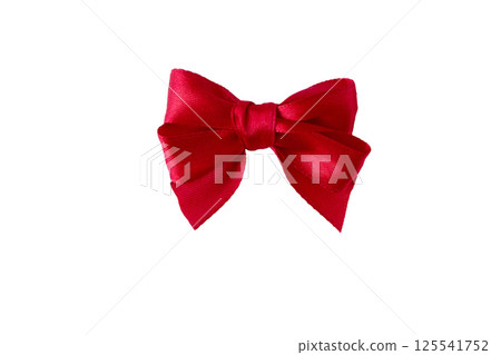 Red satin ribbon bow isolated on white. Coquette style silk bow. 125541752