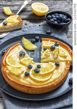 Cheesecake with blueberries sliced on a plate 125542708