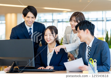 Businessmen working in an office. Photo courtesy of Denpa Gakuen, Tokyo Electronics College. Businessmen working in an office. Photo courtesy of Denpa Gakuen, Tokyo Electronics College. 125543618
