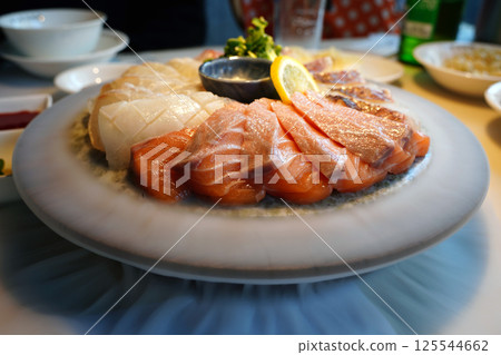 Exquisite Sashimi Platter with Fresh Salmon and Seafood Presentation 125544662