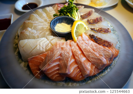 Exquisite Sashimi Platter with Fresh Salmon and Seafood Presentation 125544663
