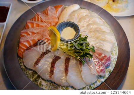 Exquisite Sashimi Platter with Fresh Salmon and Seafood Presentation Exquisite Sashimi Platter with Fresh Salmon and Seafood Presentation 125544664