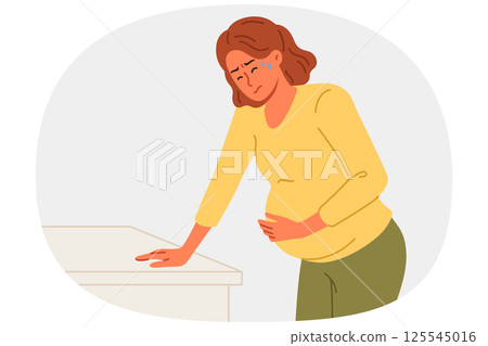 Pregnant woman holds stomach, for concept complications caused by fetal development disorders Pregnant woman holds stomach, for concept complications caused by fetal development disorders 125545016