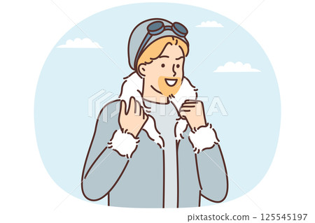 Man in jacket with fur collar looks into distance and smiles while on winter journey Man in jacket with fur collar looks into distance and smiles while on winter journey 125545197