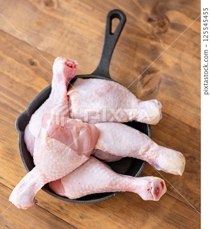 Raw chicken drumsticks Raw chicken drumsticks 125545455