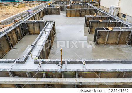 Foundation construction site of housing Foundation construction site of housing 125545782