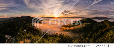 High angle view drone view of fog in rainy season over mountains,Beautiful sunrise sky clouds nature background High angle view drone view of fog in rainy season over mountains,Beautiful sunrise sky clouds nature background 125546918