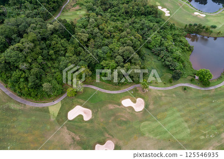 Aerial view of beautiful green golf field fairway and putting green, Top down image for sport background and travel nature background, Amazing green nature view 125546935