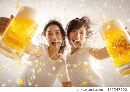 A woman toasting with a beer mug 125547560