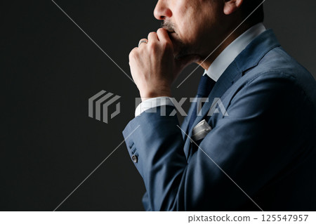 Businessman thinking sideways 125547957
