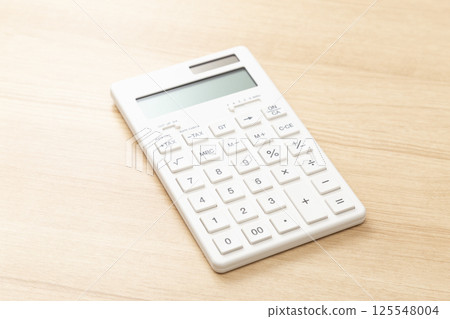 calculator on the desk calculator on the desk 125548004