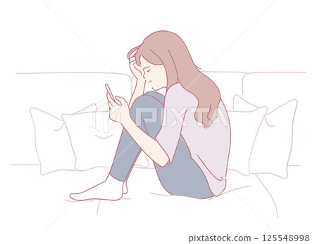 A woman is sitting comfortably on a couch and using her smartphone, expressing various emotions 125548998